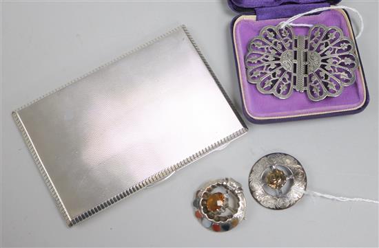 A silver engine-turned cigarette case, a Scottish silver cairngorm-set brooch, a similar brooch set hardstones and a silver buckle